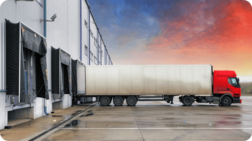 A semi truck parked in front of a building.